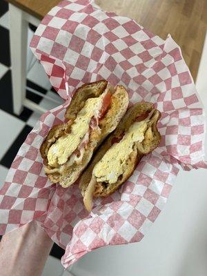 Egg, cheese, tomato bagel sandwich