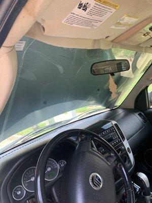 Inside view of bent hood and cracked windshield that blew up as I was driving could have killed me