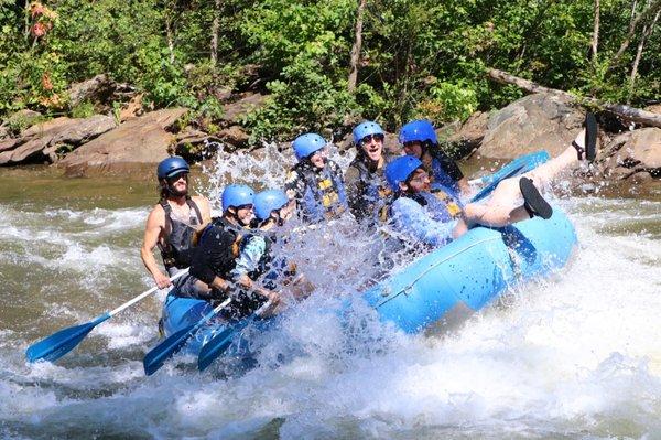 The family getting blasted by water while our instructor, Jace stays totally calm