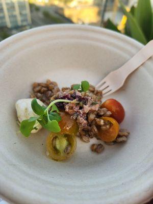 Porcine infused Farro, bocconcini, cherry tomatoes, truffle oil and tapenade. Above Ash Social