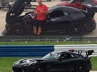 Dr Lange leaning against his Voodoo 2 race car at Sebring Raceways.