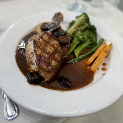 Grilled pork chop stuffed with mozzarella and prosciutto, broccoli, carrots and red potatoes (daily special)