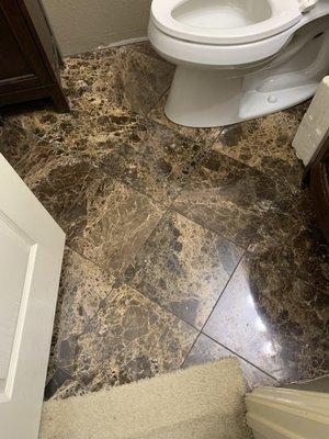 Replaced carpet with new Marble flooring in restroom.