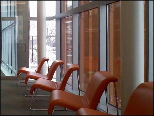 orange mod chairs by the orange angled lighting panels