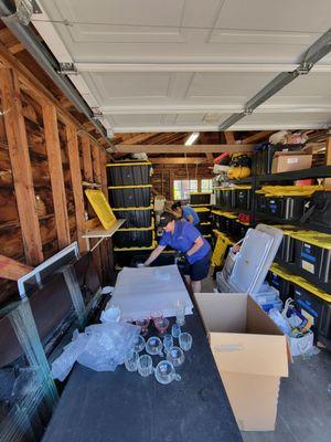 Packing crew repacking glass items.