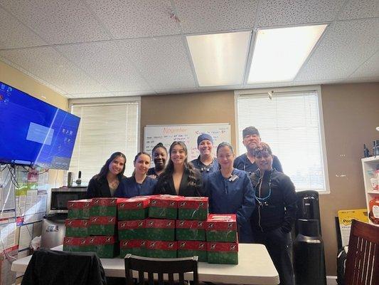 Our Team loves to give back! Operation Christmas Child.