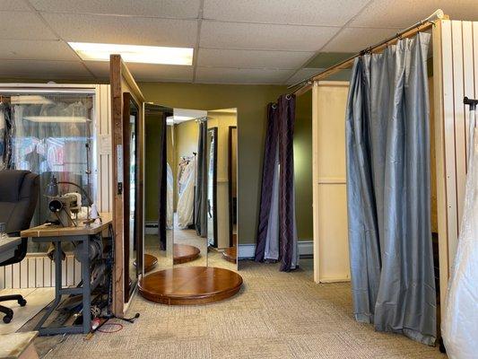 Interior of store where you can try on clothing and get it pinned for tailoring.