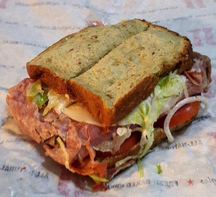 Gargantuan: Salami, Capicola, Turkey, Roast Beef, Ham, Provalone, onion, lettuce, tomato, mayo, oil & vinegar, basil, on Sliced Wheat Bread.