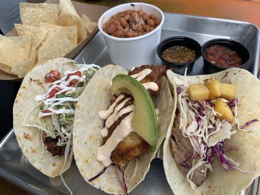 Shrimp, fish, and pulled pork taco and the red beans and rice. Delicious!