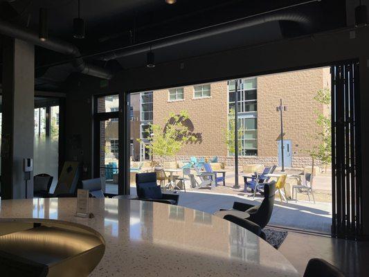 View of the open bay doors from the high counter seating area.  They have lovely padded leather chairs!