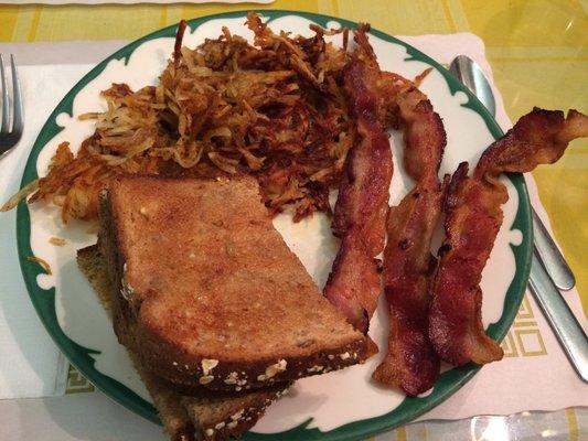 Side orders of 12-grain toast, bacon, and the BEST hash browns ever!