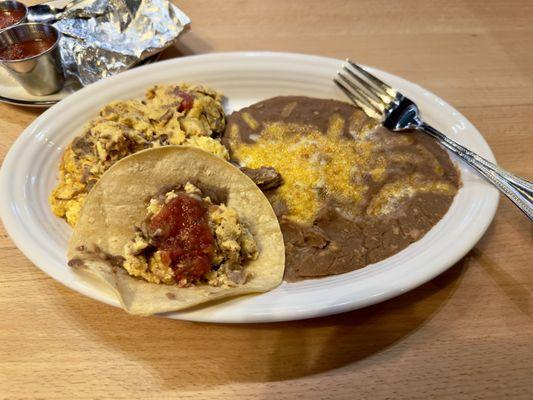 Machaca and Eggs - Shredded beef, tomato,  onions, bell peppers with salsa and corn or flour tortillas.