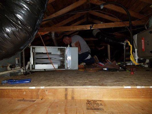 technician installing furnace and ac