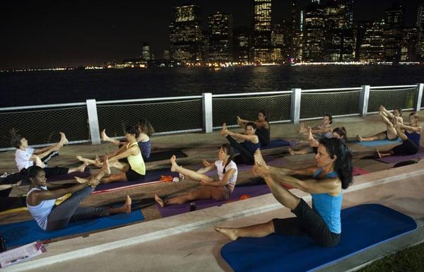 Lou teaching her Sunset Pilates class down at Pier 5 Brooklyn Bridge Park