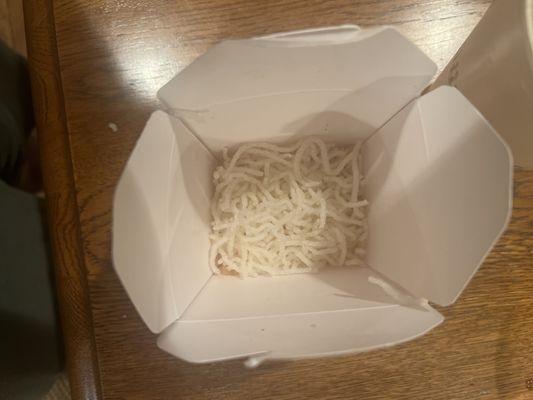 Fried rice noodles in the bottom of fried chicken container to help profits