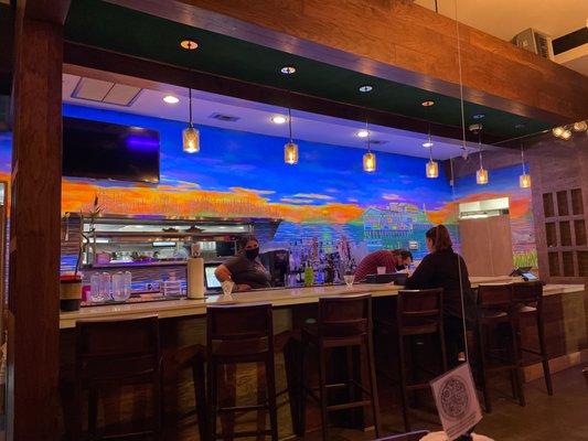 Bar and a view into the kitchen