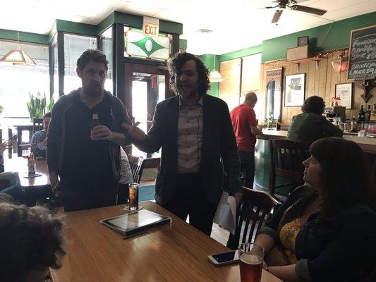 Tour guide Matthew regals participants on history of neighborhood favorite, Cunneen's.