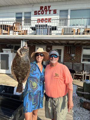 Charter Captain Ed helps this young lady show off her keeper