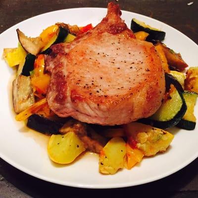 Seated pork chop over summer squash. Dairy free, gluten free, paleo-approved.