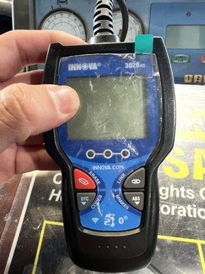 Scanner used to diagnose Check Engine Light.