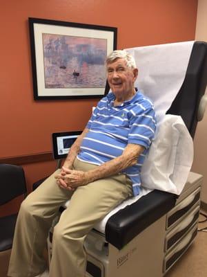 A delightful Dad waiting in examination room.