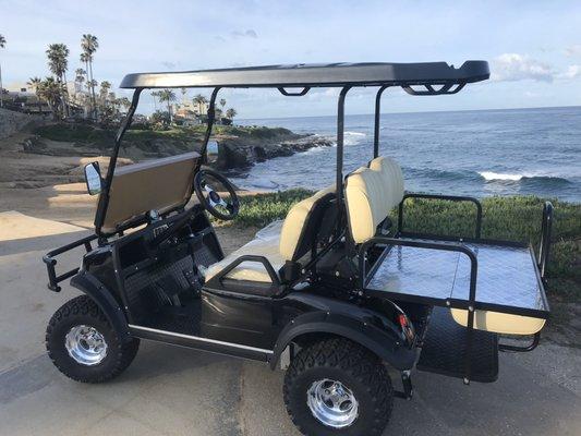 4 passenger lifted cart near La Jolla Showroom