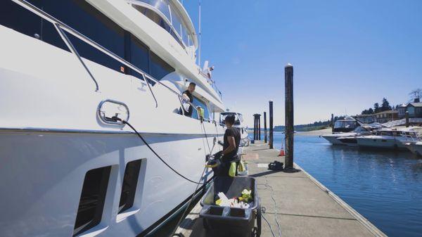 Our crew detailing a 70 foot Ocean Alexander yacht.