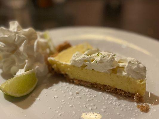 Key lime pie. A perfect portion of sweet and tart key lime pie with a unique crust.