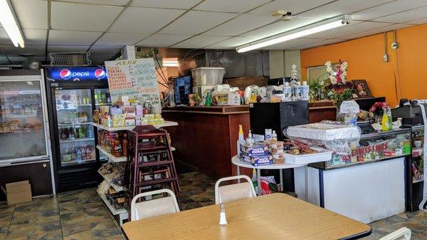 Counter, kitchen, and drink coolers.