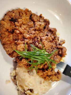 Fried steak, smashed potatoes