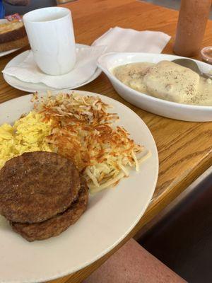 Biscuit and gravy meal with hash browns.