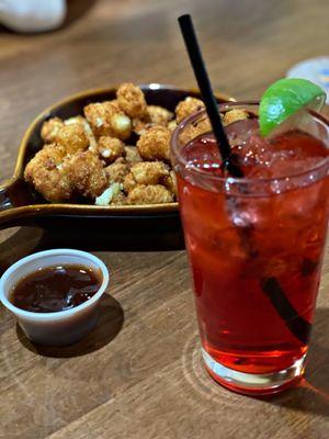 Cheese curds with bbq sauce from the appetizer menu.   With this delicious Michigan Cherry Hard Seltzer.