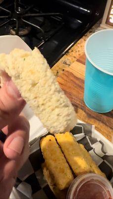 What in God's name is this? Frozen mozzarella sticks that look like white dog turds. Disgusting and unsafe to eat.