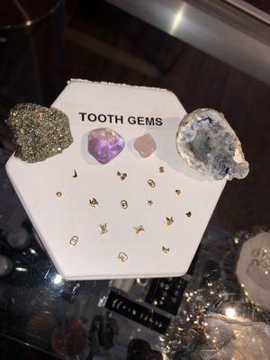 14kt gold tooth charms available and can be done here at Poke A Dotz tattoo and piercings