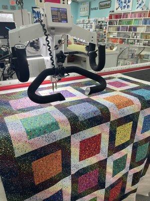 Quilting this adorable baby quilt made with Glass Beads from Wilmington Fabrics!