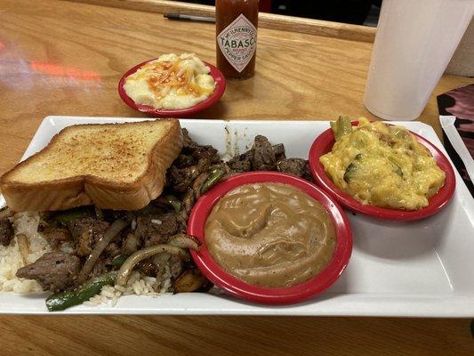 Beef tips and rice-all the way, gravy on side, cheese grits, broccoli cheese casserole. Sweet Tea.