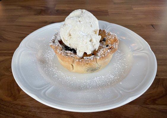 Warm blueberry tart with homemade vanilla ice cream