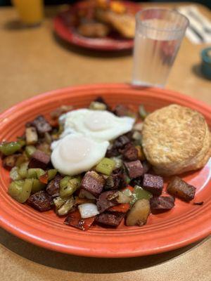 Corned beef hash with poached eggs, sub toast for biscuit (extra)