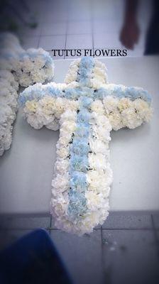 An All carnations sympathy cross.