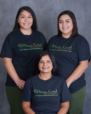 Sugar Creek Smile Dentistry caring staff- Dr. Savita Hemrajani with Front Office Jacqueline and Dental Assistant Esthefane.