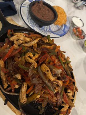 Chicken fajitas, refried beans & Mexican rice