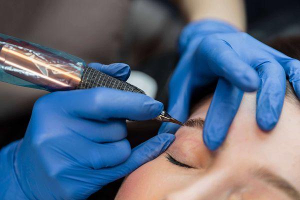 Microblading treatment by permanent makeup artist.