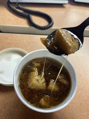 French onion soup with provolone cheese and croutons