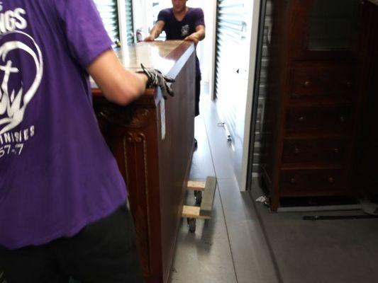 Nathan and Josey moving a 600 lb dresser on the 4 wheel dolly