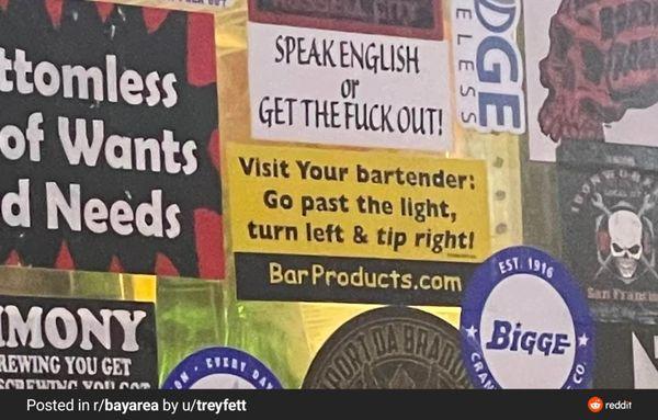 Bigoted sticker behind the bar.