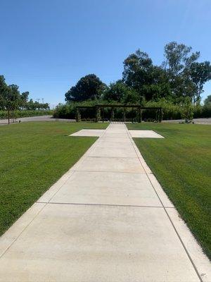 Walkway to the other outdoor space (brown arch)