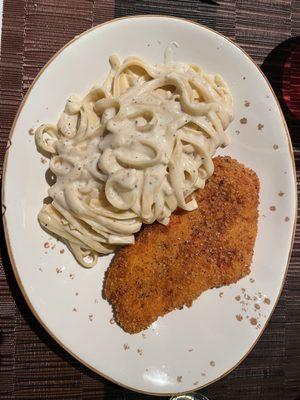 Fettuccine Alfredo with chicken (mixed in an aged wheel of Parmesan.