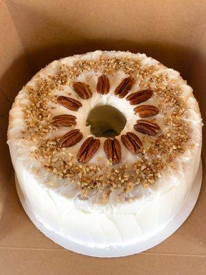 "It's 5 o'clock Somewhere" - bourbon pecan pound cake with bourbon cream cheese frosting and garnished with pecans.