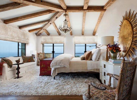 Reclaimed 1800's Hand Hewn Beams in a Bedroom in Malibu