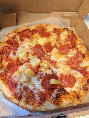 Small pepperoni and pineapple pizza